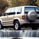 Illustration for article titled Here Are Some Pictures Of An Isuzu Trooper In A Stream